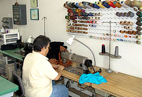technician sewing a garment at LA Leather Cleaners